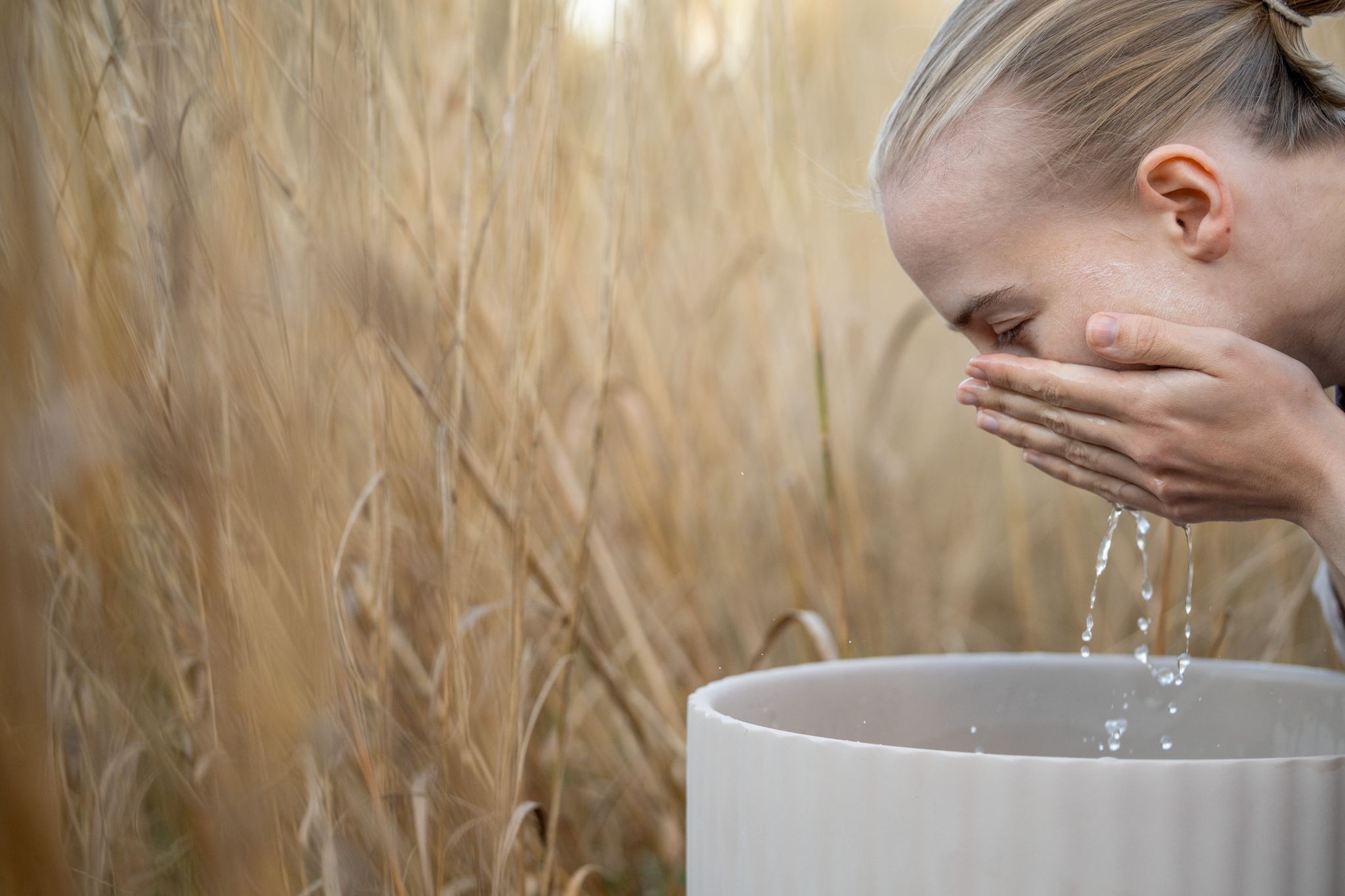 woman washing her face