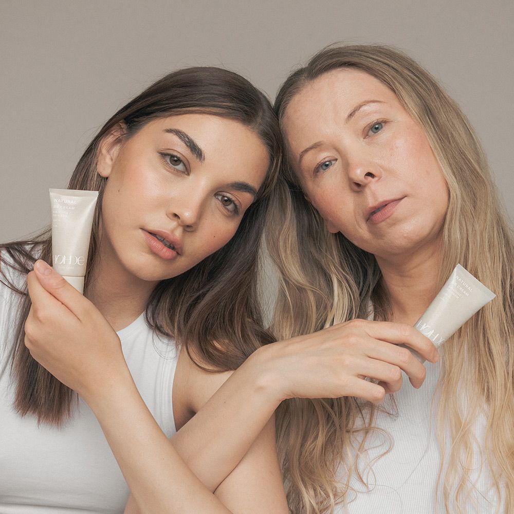 two women holding bb creams