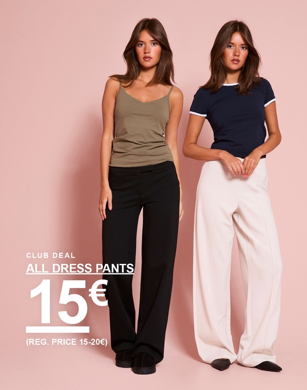 Meisje draagt een beige top en nette broek, en een donkerblauw T-shirt met witte details en een witte nette broek. CLUB DEAL – ALL DRESS PANTS €15 (REG. PRICE €15–20).