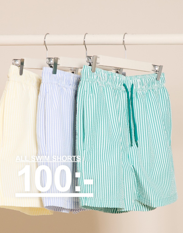 Tre randiga badshorts på galgar i gult, ljusblått och grönt. ALL SWIM SHORTS 100:-
