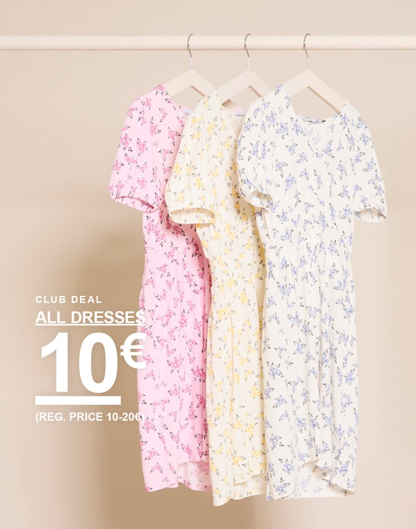 Drie bloemige jurken in de kleuren roze, geel en wit aan hangers tegen een lichte achtergrond. CLUB DEAL ALL DRESSES 10€ (REG. PRICE 10-20€)