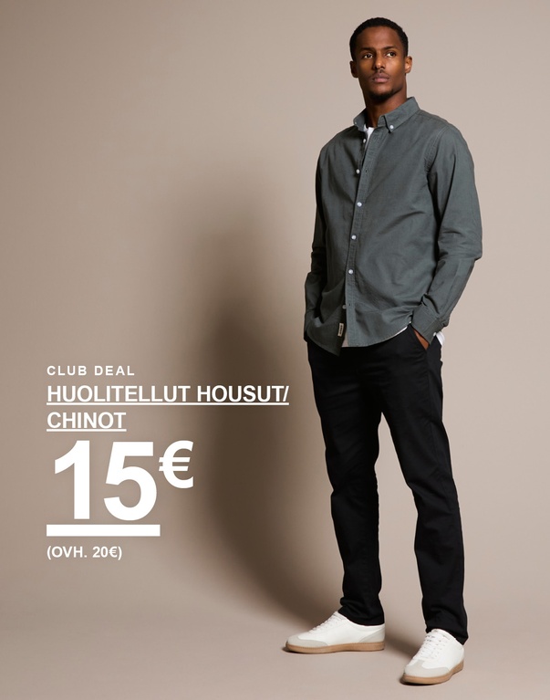 Mies tummanvihreässä paidassa ja mustissa chinoissa tekstillä "Club Deal Huolitellut Housut/Chinot 15€ (ovh. 20€)".