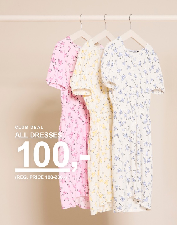 Tre blomstrete kjoler i fargene rosa, gul og hvit på kleshengere foran en lys bakgrunn. CLUB DEAL ALL DRESSES 100,- (REG. PRICE 100-200,-)