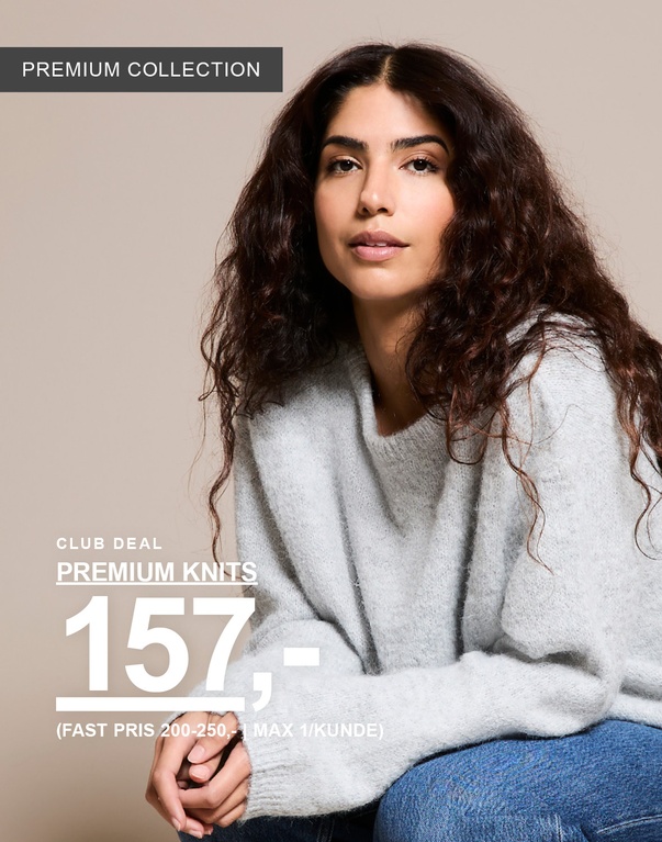 Kvinne i lysegrå strikkegenser fra Premium Collection. Kampanjetekst: "CLUB DEAL, PREMIUM STRIKK 157,- (FAST PRIS 200–250,- | MAKS 1/KUNDE)".