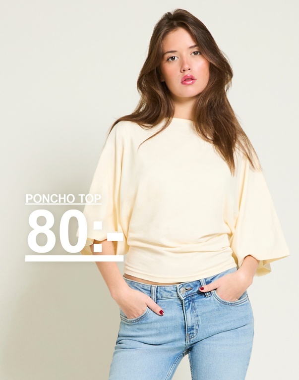 Tjej i ljusgul ponchotopp. Kampanjtext: "PONCHO TOP, 80:-".