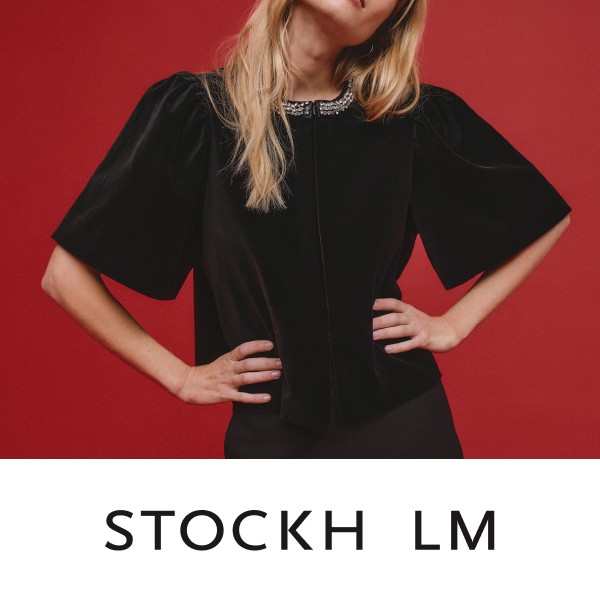 Modetøj til dame fra Stockh lm . Kvinde iført en sød festlig kort jakke.