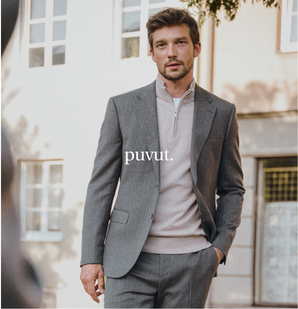 Harmaa bleiseri ja neulepusero miesten alla.