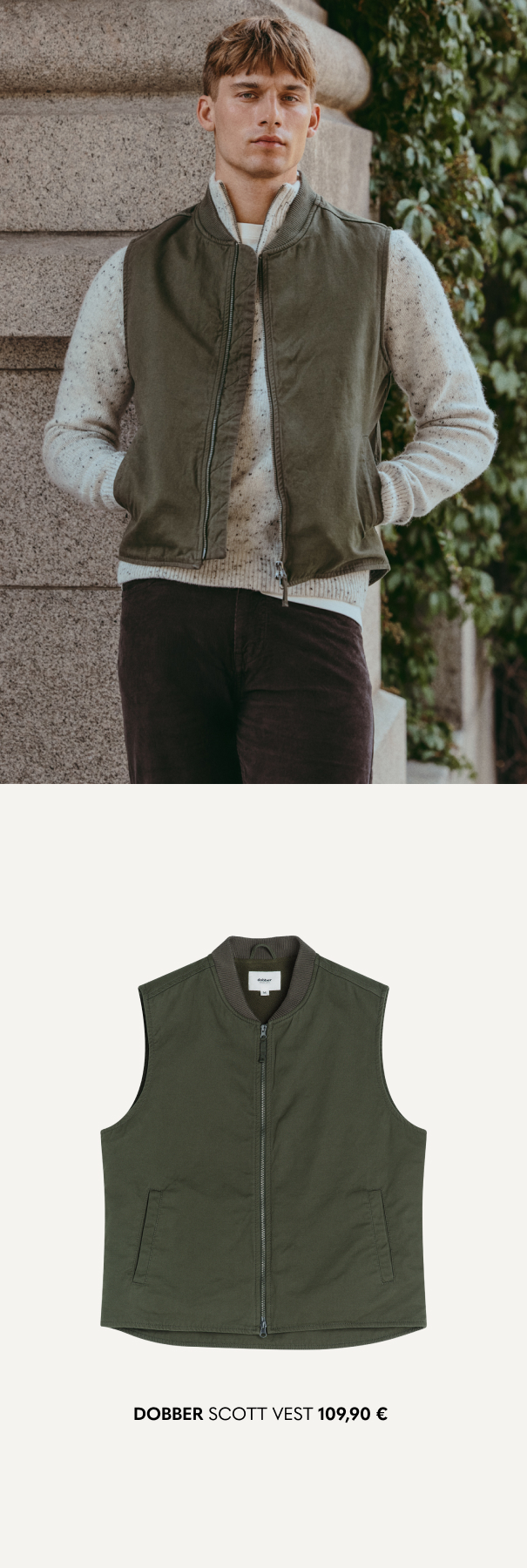 Vihreä liivi harmaalla neulepuserolla, jossa vetoketju.