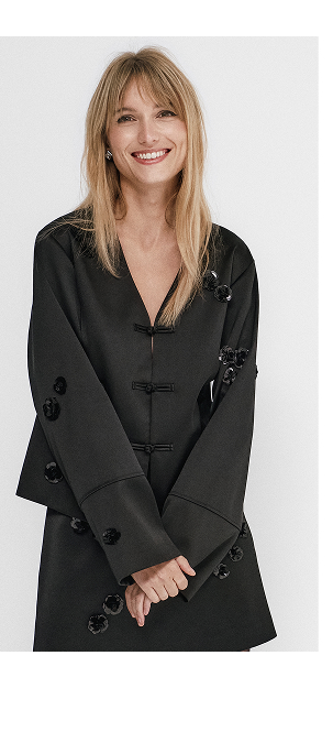 Musta paljettipusero, jossa hieno suljin