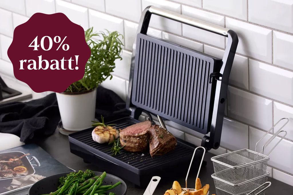 En paninigrill ståendes på en köksbänk med en sticker som säger 40% rabatt!