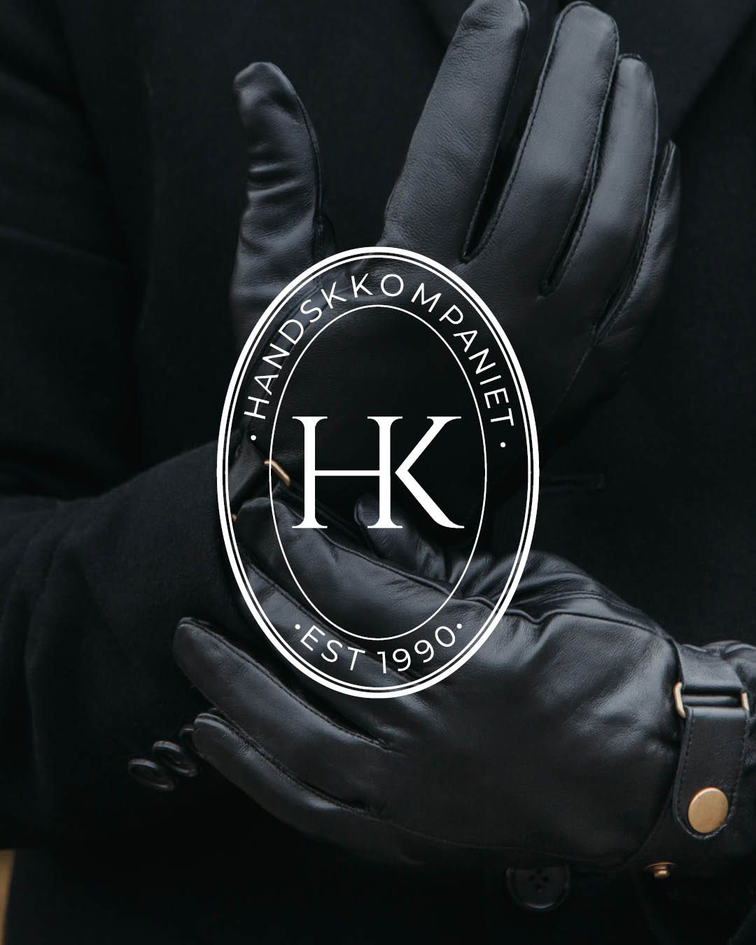 Detaljbilde av skinnhansker med handskkompaniet logo