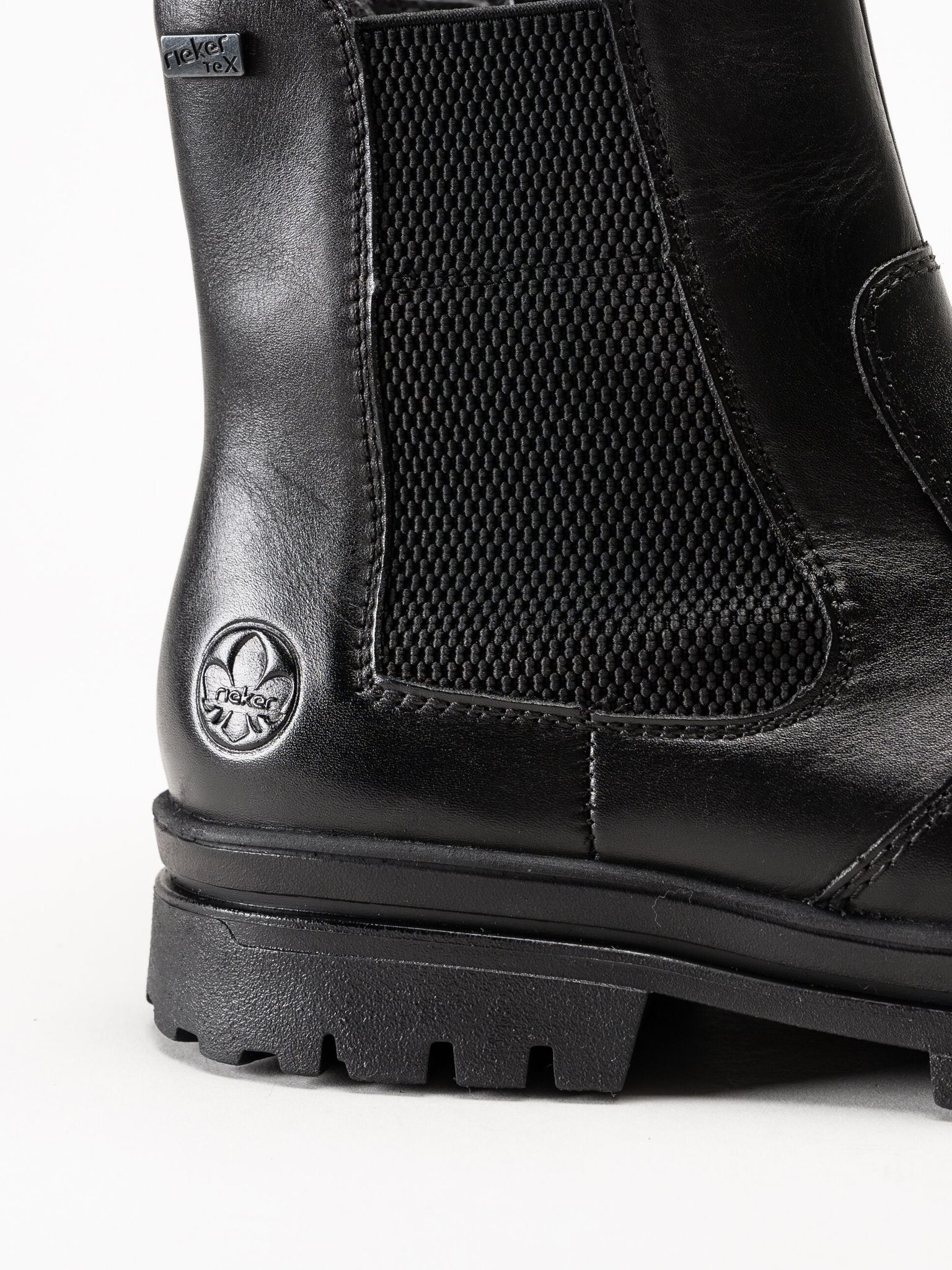 Rieker - Svarta fodrade boots med broddar
