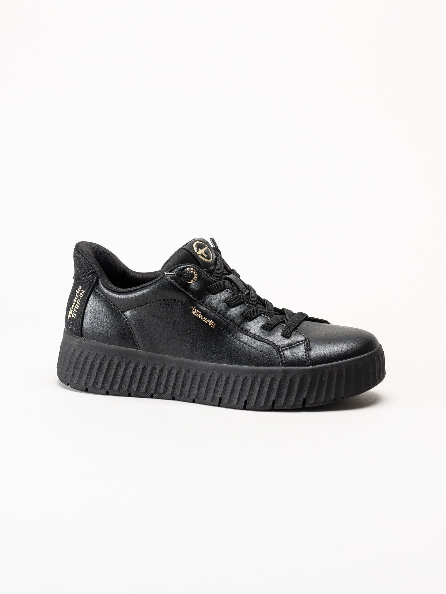 Tamaris - Svarta sneakers i skinn
