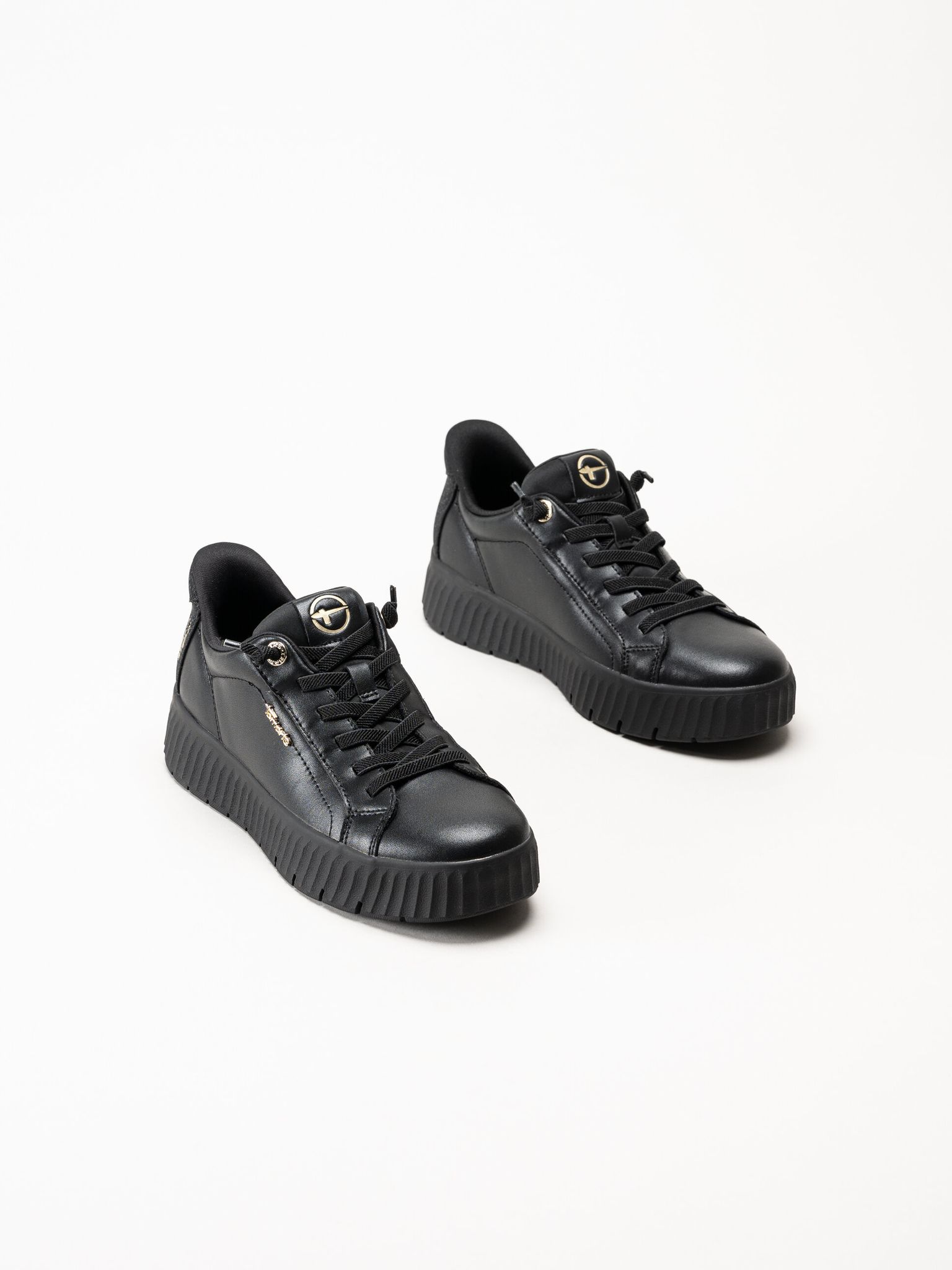 Tamaris - Svarta sneakers i skinn