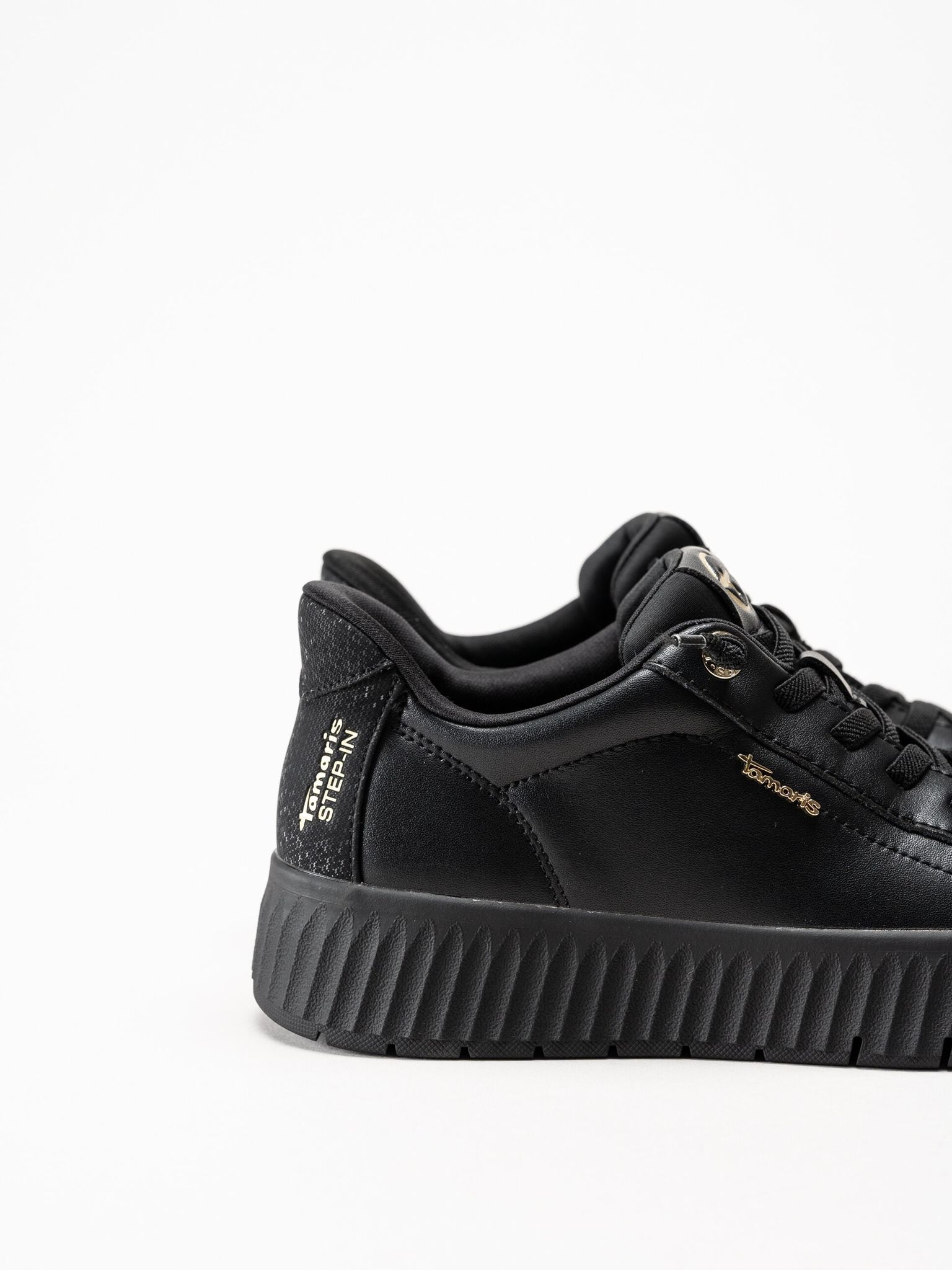 Tamaris - Svarta sneakers i skinn