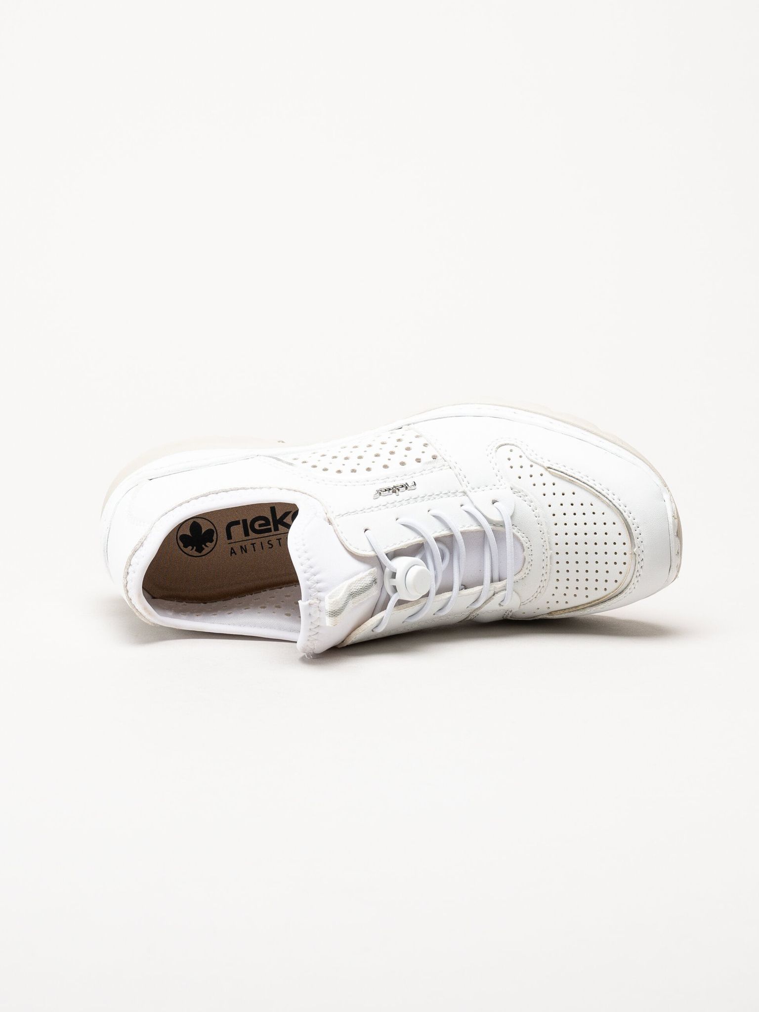 Rieker - Vita slip on skor i skinnimitation