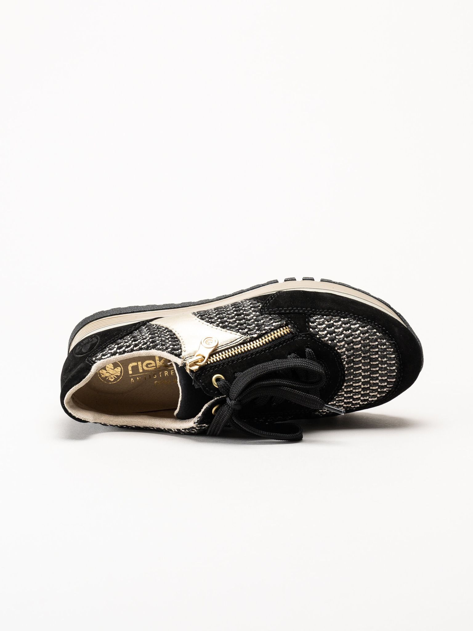 Rieker - Svarta sneakers i mocka och textil