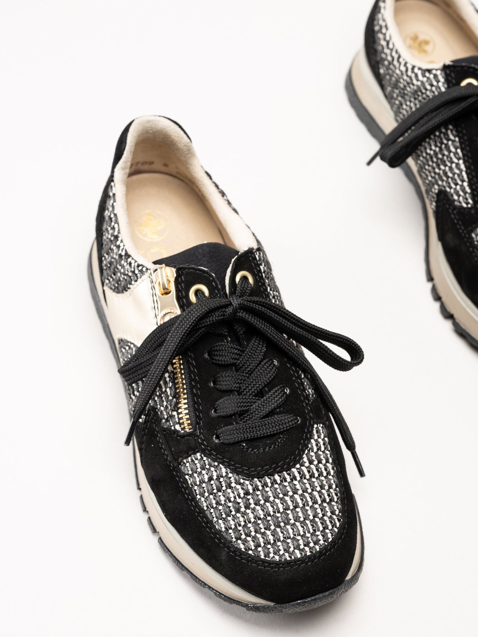 Rieker - Svarta sneakers i mocka och textil