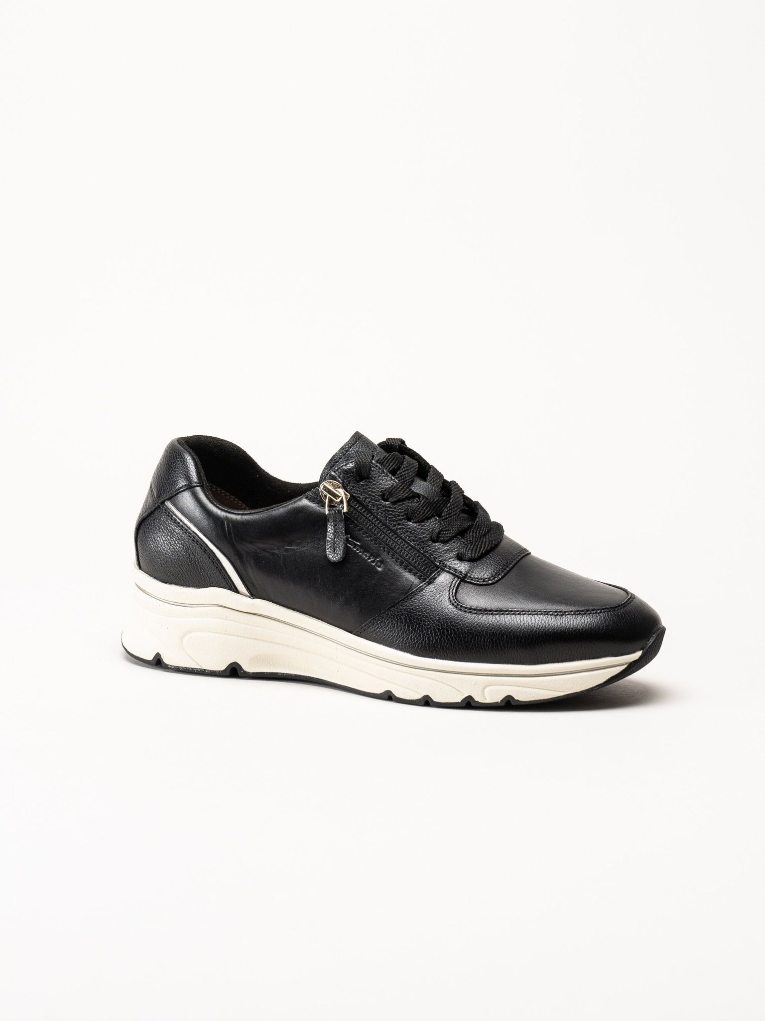 Tamaris - Svarta sneakers i skinn