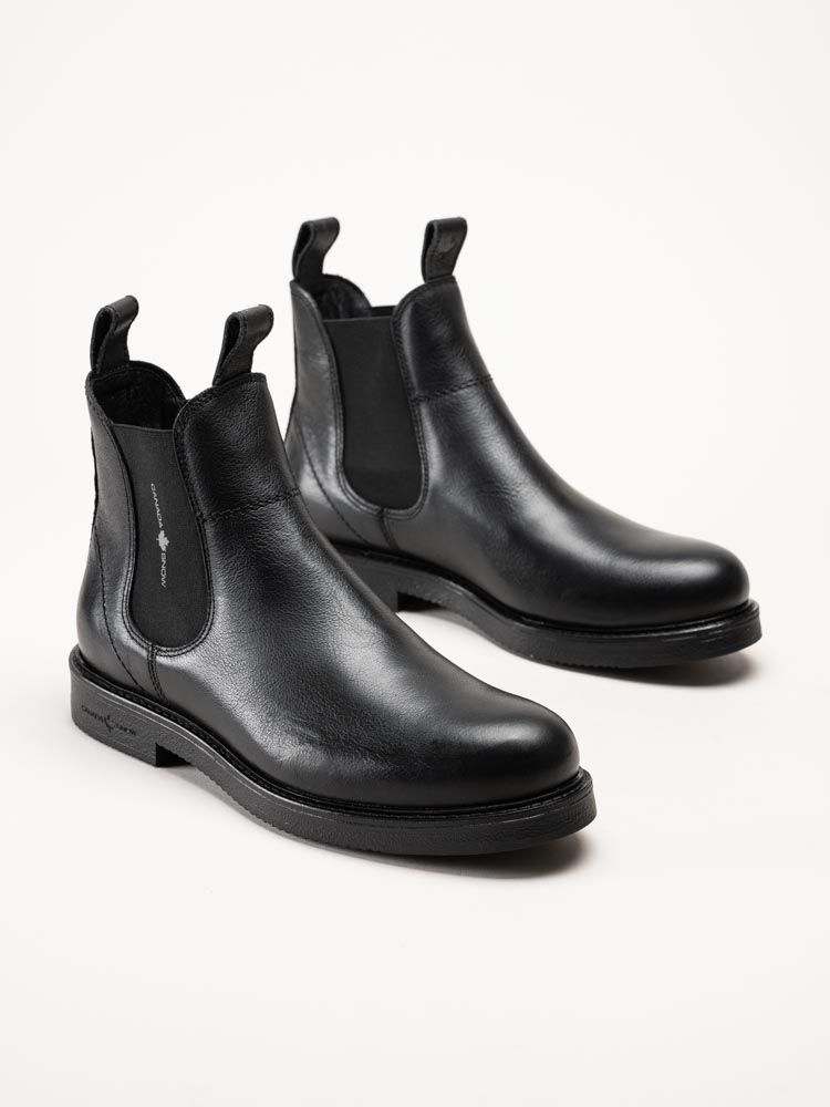 Ett par svarta Chelsea-boots i läder