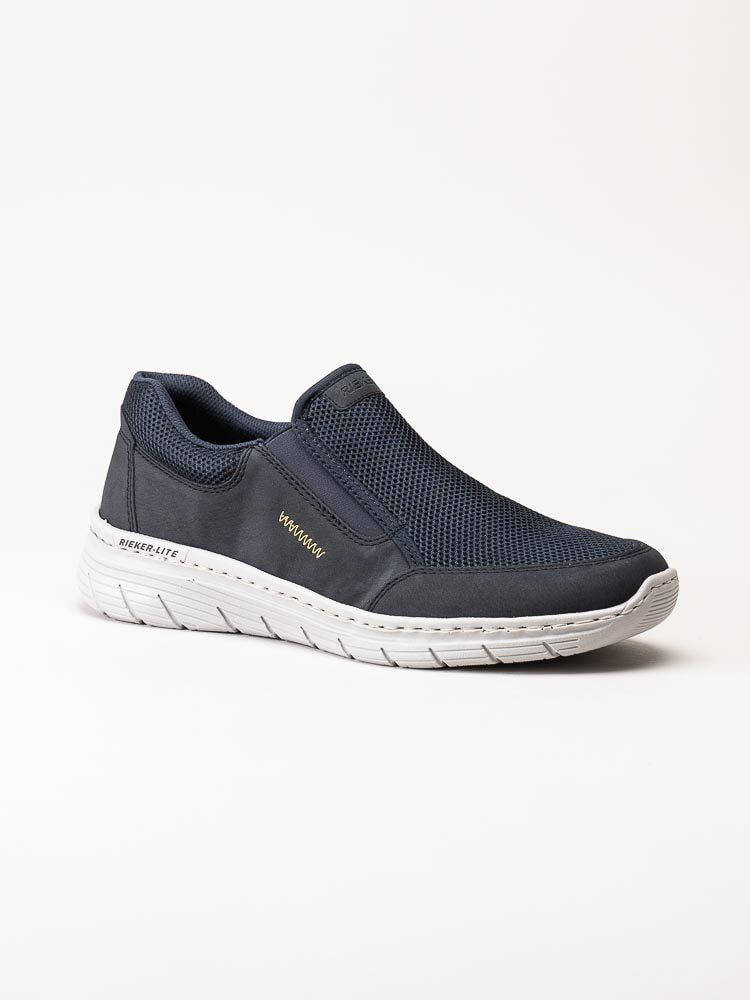 Rieker - Mörkblå slip on skor i textil