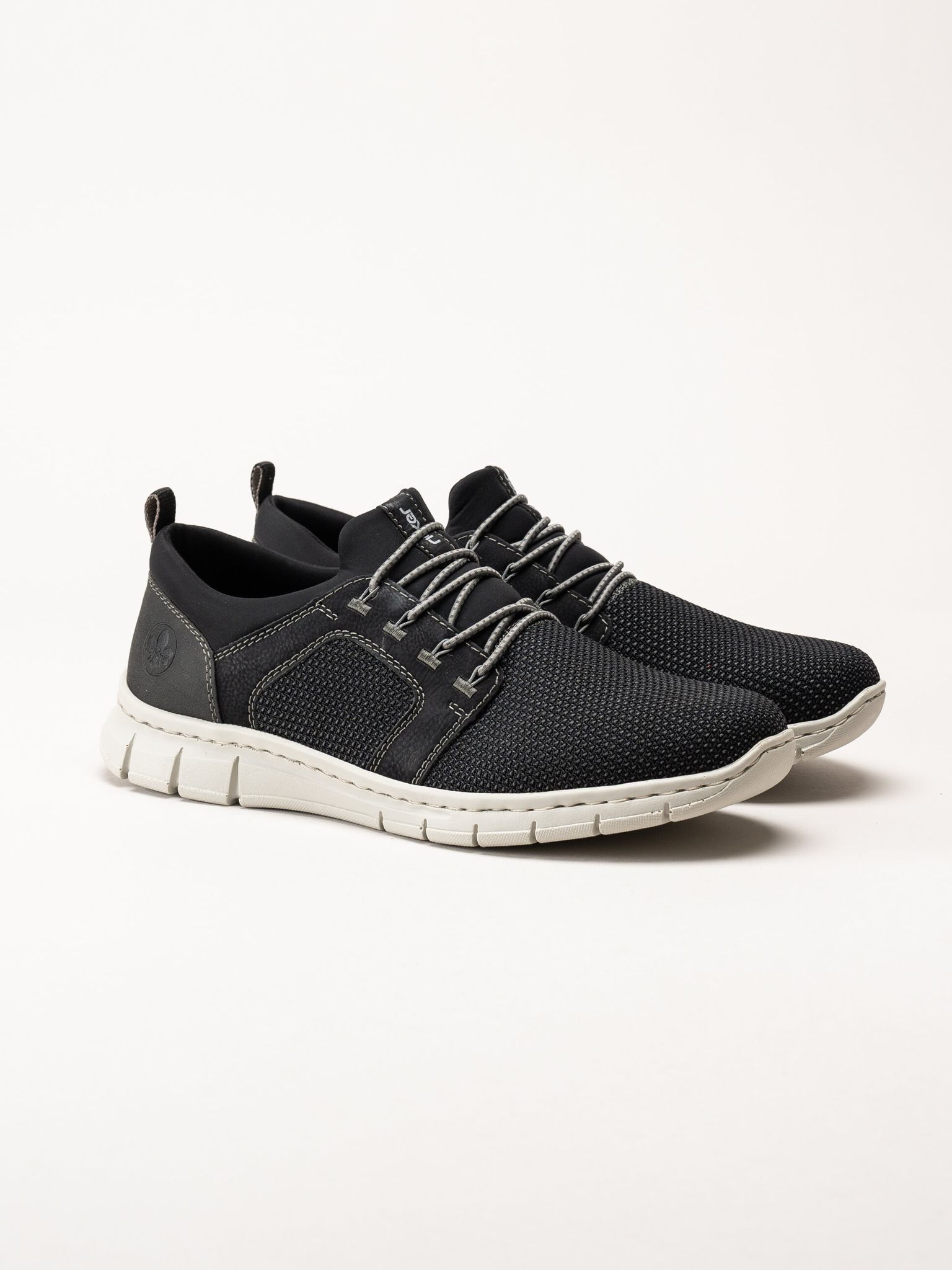 Rieker - Svarta sportiga slip on skor