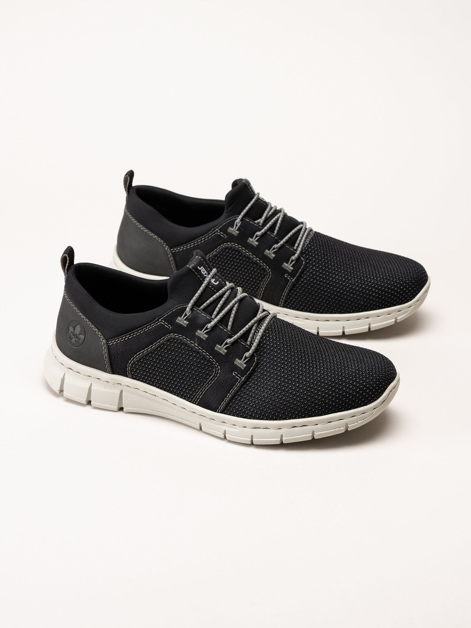 Rieker - Svarta sportiga slip on skor