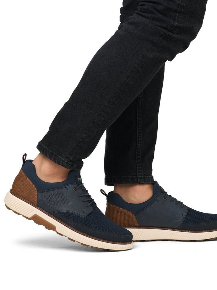 Rieker - Mörkblå slip on skor i textil