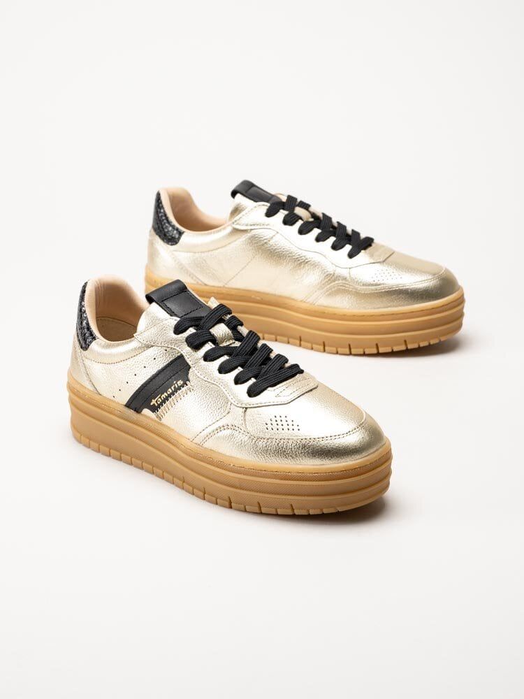 Tamaris - Guldfärgade platåsneakers i skinn