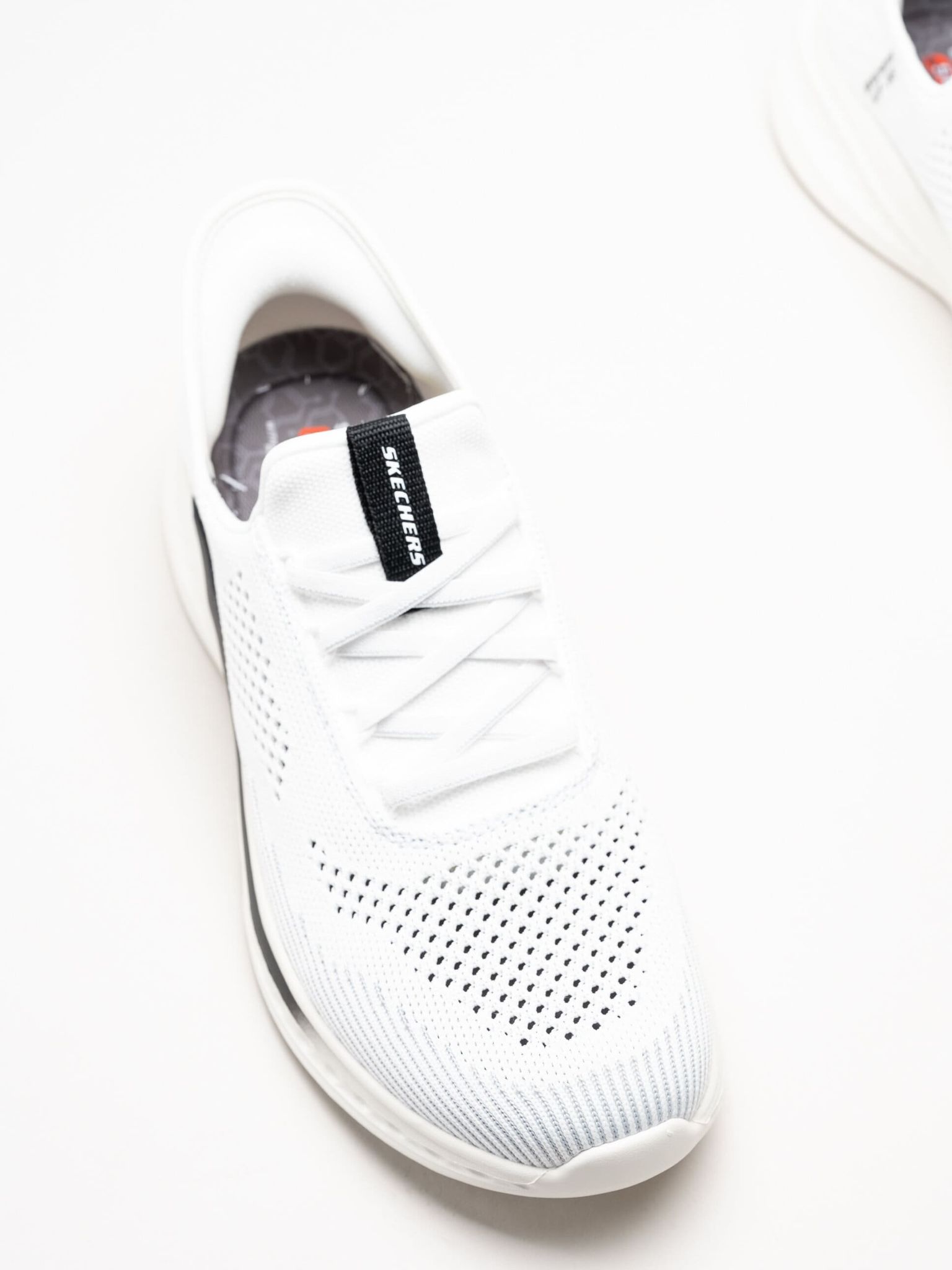 Skechers - Relaxed Fit - Vita slip-ins sneakers i stickad textil