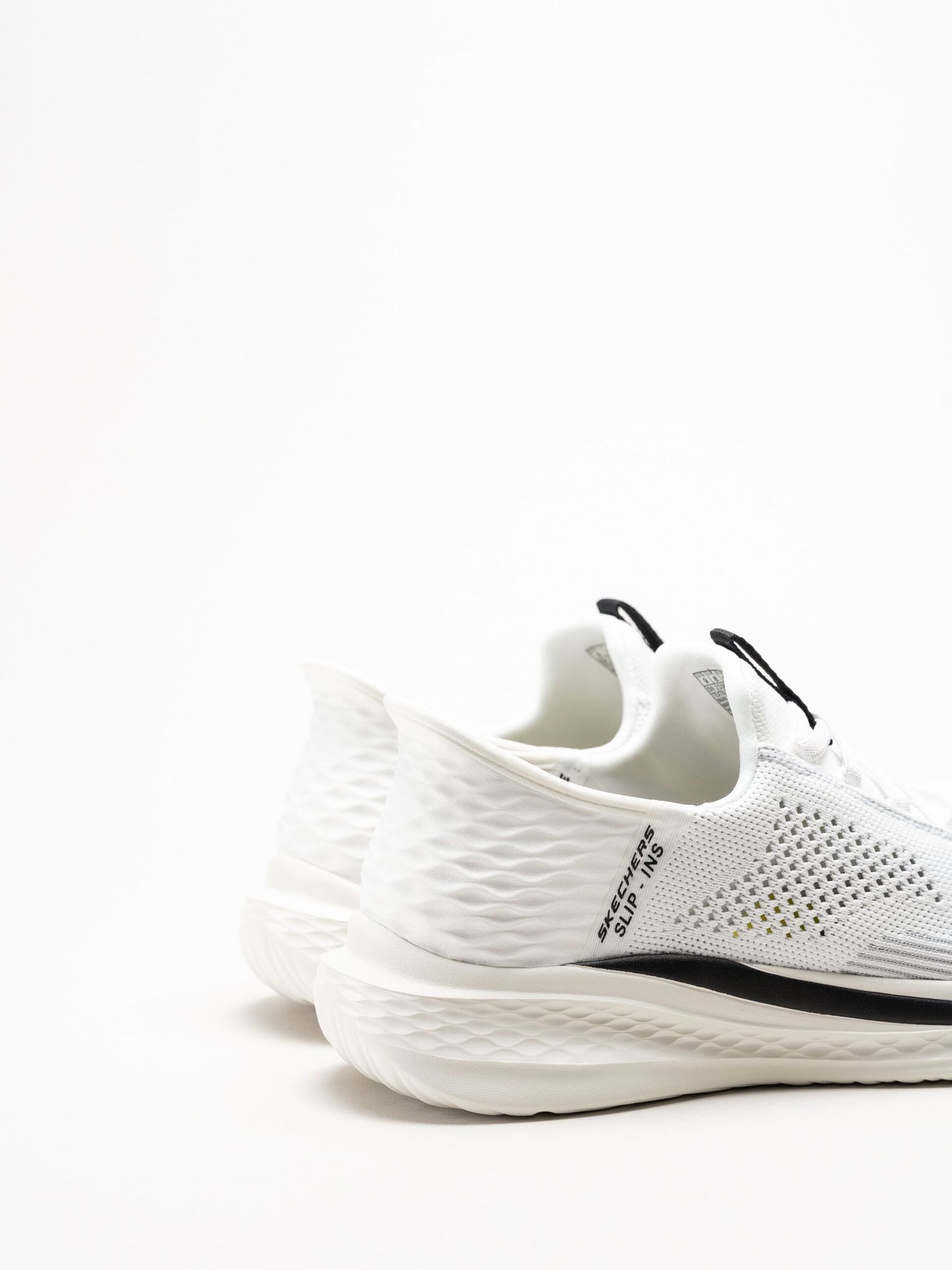 Skechers - Relaxed Fit - Vita slip-ins sneakers i stickad textil