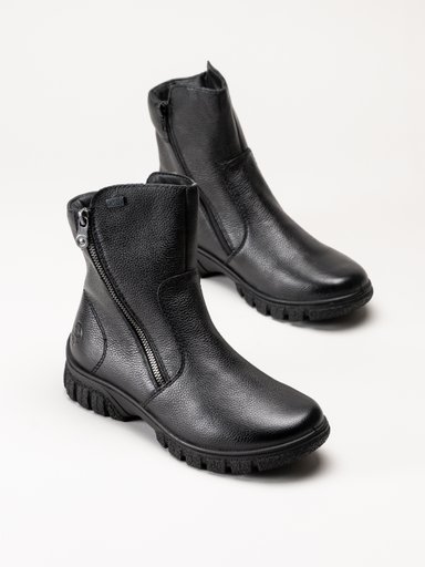 Svarta ankelboots i läder med sidodragkedjor och kraftiga sulor