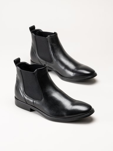 Ett par svarta Chelsea-boots