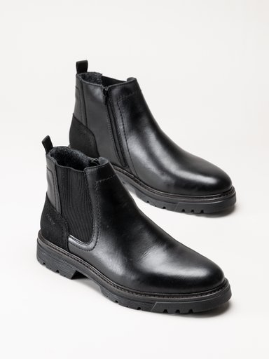 Svarta ankelboots med sidodragkedjor och kraftiga sulor