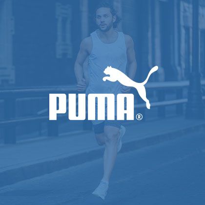 En kille som springer i Puma kläder