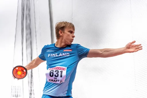 Young athlete throwing a discus