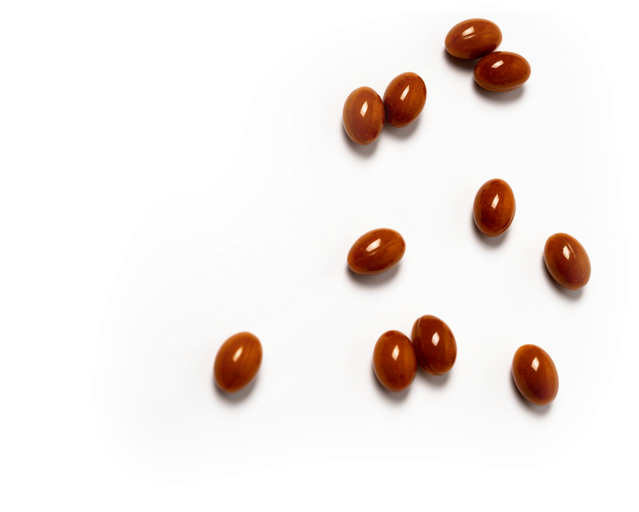 Brown capsules white background