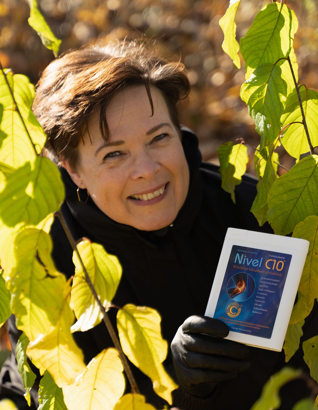 Happy woman holding Nivel c10 